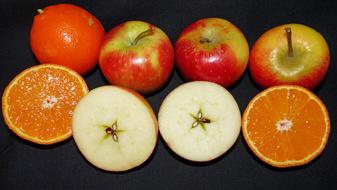 Delicious sweet fruits on a black background
