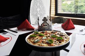 pizza with basalis in a restaurant