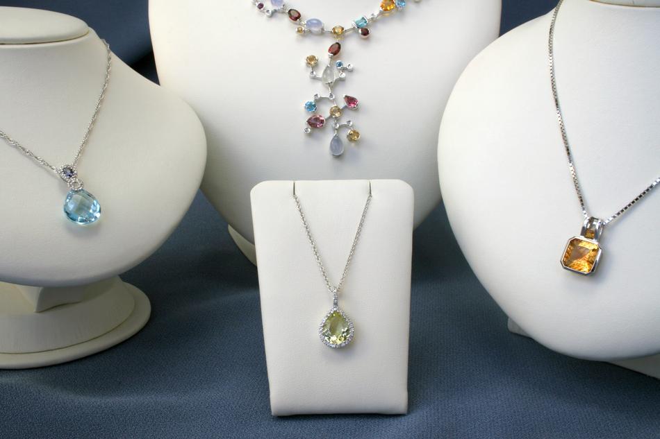 white mannequins in beautiful jewelry.