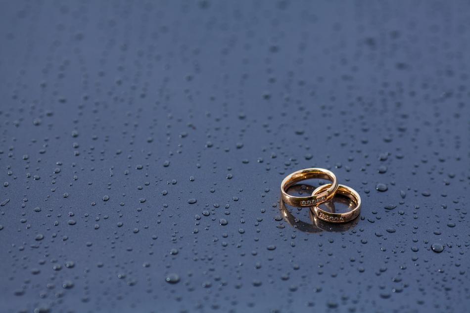 Wedding Golden Rings on wet background