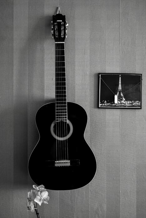 guitar as decoration on the wall, black and white