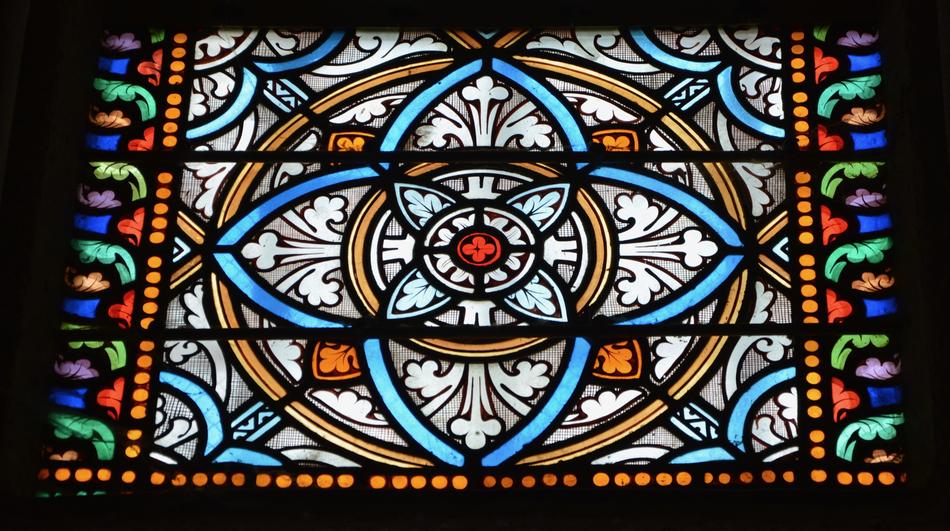 a colorful mural in a glass window