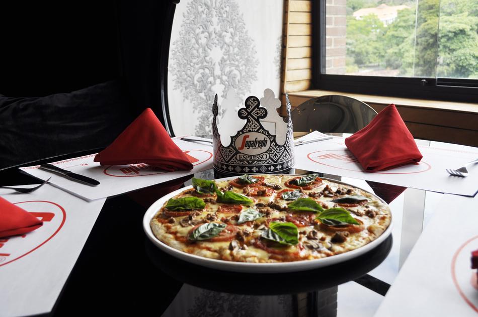 pizza with basalis in a restaurant