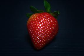 sweet strawberries on a black background