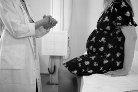 photo of a pregnant woman at a doctor