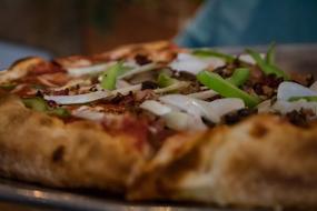 Crispy hot pizza with onions