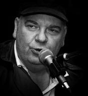 black and white portrait of the singer near the microphone