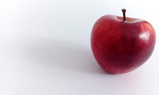 Red juicy apple on a white background