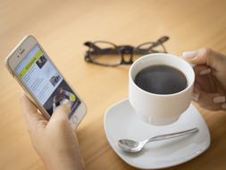 hot coffee and a cell phone