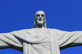 jesus sculpture background blue