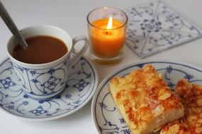 coffee and dessert with a candle