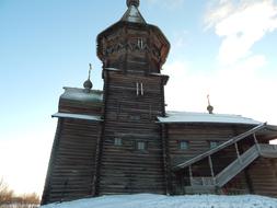 wooden house in the snow