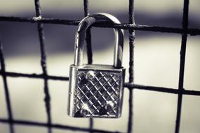 a small lock on the fence