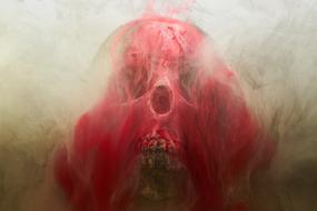 Red skull, among the smoke, in light, clipart