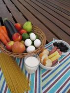 Fresh vegetables and eggs in a basket