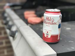 iron can of beer on the grill