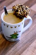 hot mug of coffee with chocolate chip cookies
