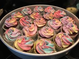 colored cream cupcakes in a plate