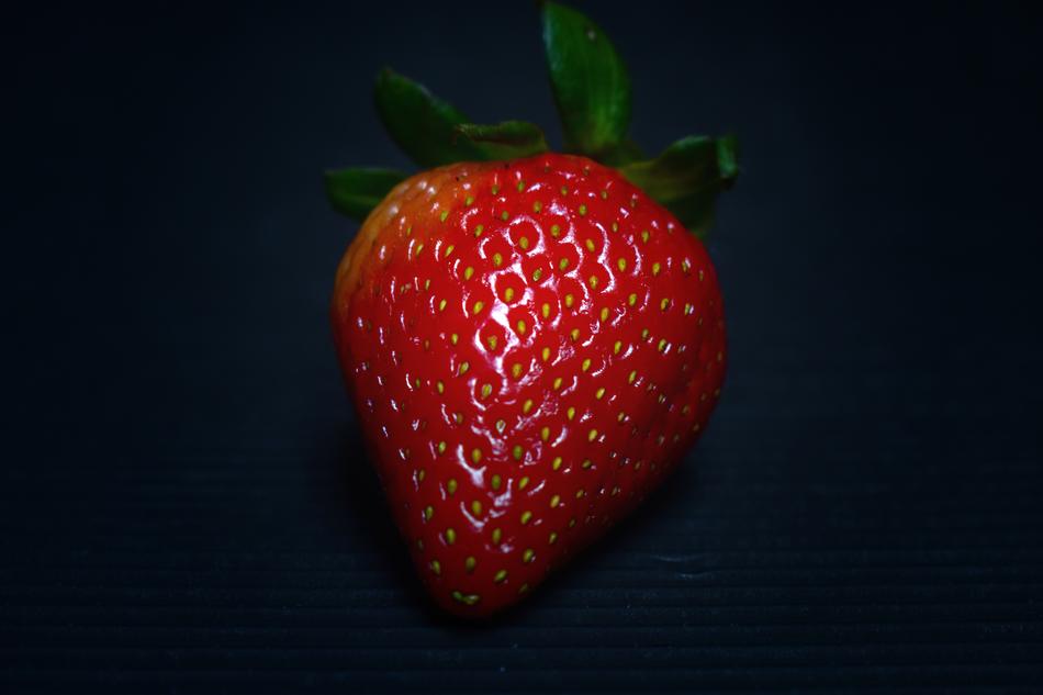 sweet strawberries on a black background