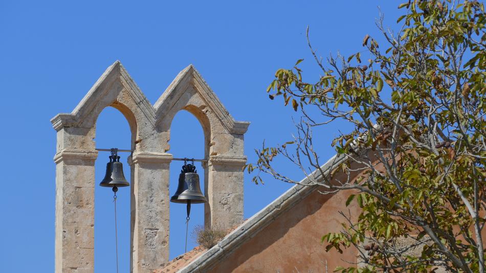 the bells of the old church against the sky