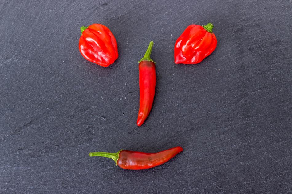 smiley on a table of peppers