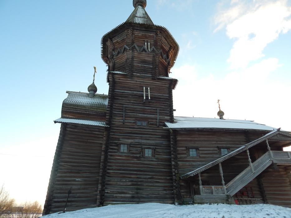 wooden house in the snow