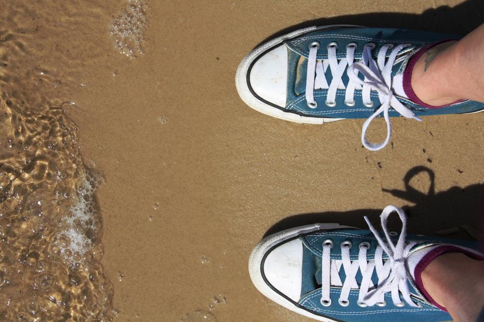 sneakers feet beach