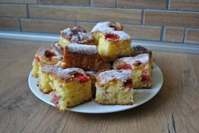 Delicious sweet cakes with white sprinkles