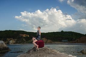 the girl in the red chair by the river