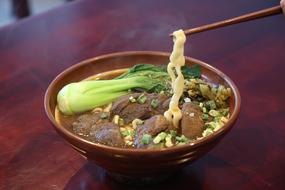 Delicious soup with dried meat and noodles