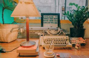 hot cup of coffee with a typewriter