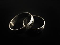 couple rings black background