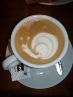 Cappuccino with a snail image