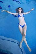 gorgeous girl in a swimsuit in the pool