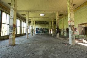 Abandoned empty Hall with graffiti on walls