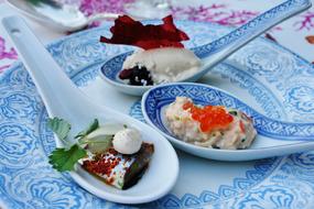 salad in blue spoons