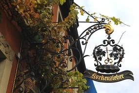 iron sign in the shape of a restaurant crown