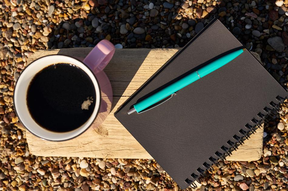 hot coffee by the notepad