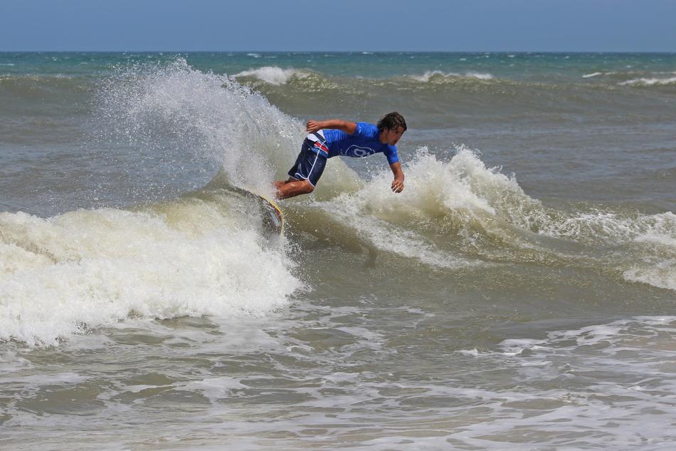 Surfer on Ocean Waves Beach