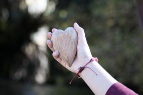 stone heart in the hands