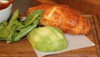 Fresh croissants with avocado