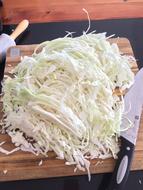 finely chopped cabbage on a board
