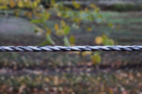 twisted rope along the paddock, close-up