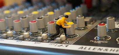 plastic figure of a man on tSynthesizer Mixer