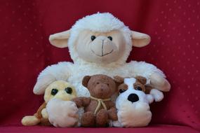 soft toys on a red background