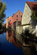 river flowing near the houses