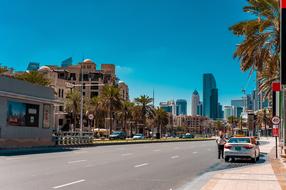 car standing on the road in a beautiful city