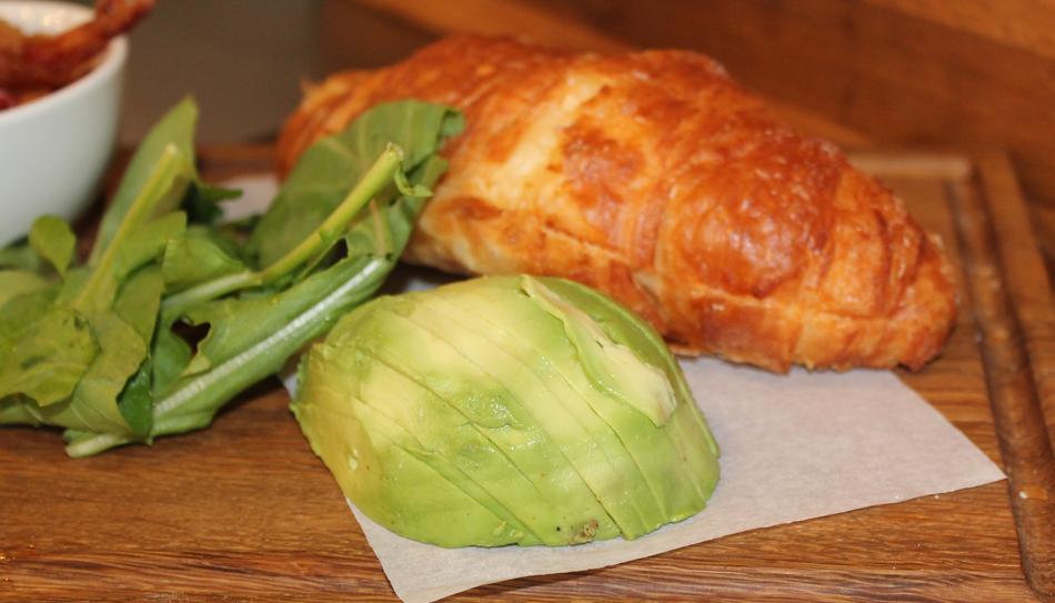 Fresh croissants with avocado