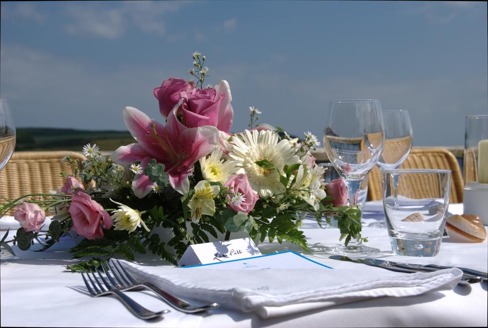a beautiful bouquet of flowers on the restaurant table
