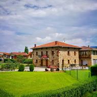 stone house near the green grass